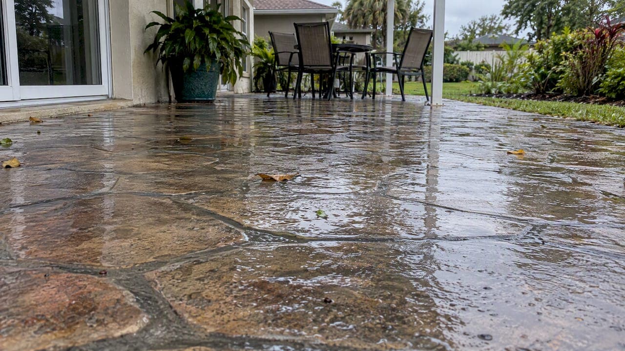 Slippery Stamped Concrete Patio? DIY First, Rubber Overlay Later